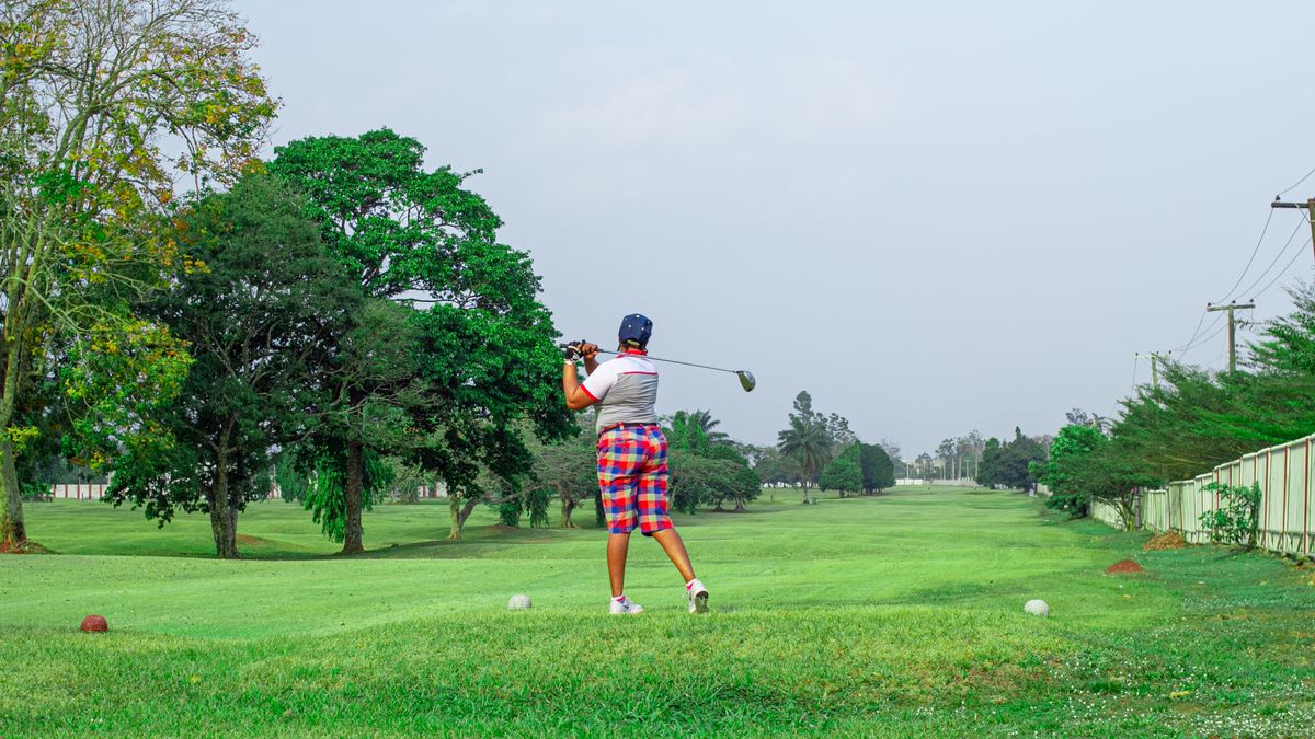 Golfer on the fairway ready to join the group ahead